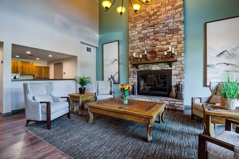 a living room with a fireplace and a table